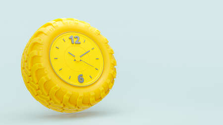 Yellow clock is shaped like yellow car tire on a blue-green background.Copy space for your text....