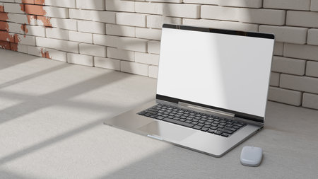 Empty display laptop with decoration minimal. Shadow from window on  brick wall and cement floor. Mock-up computer and minimalism concept, 3D Render.の写真素材