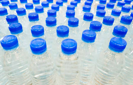 Group of drinking water bottle in plantの写真素材