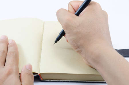 Hand writing in notebookの写真素材