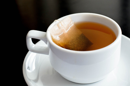 Cup of tea on back tableの写真素材