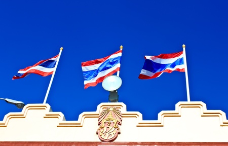 Thai Flag and Emblem King. Blue sky background.の写真素材