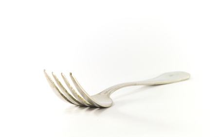 a silver fork on a white backgroundの写真素材