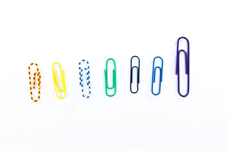 Set of colored paper clips isolated on white background.の写真素材