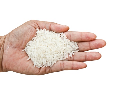 Rice in hand  Plenty of rice in hand, isolated on white background の写真素材