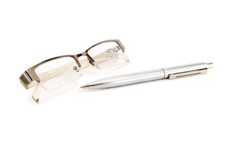 eyeglasses and pen isolated on white backgroundの写真素材