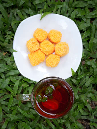 Tea lemon and mint on grass  And Thai dessert の写真素材