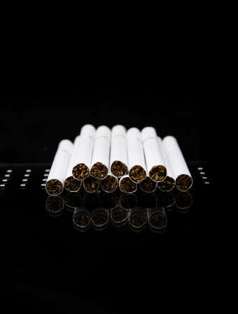 Cigarettes in a row and reflection  World No Tobacco Day の写真素材