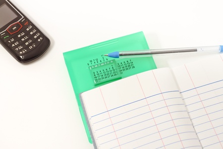 Papers on financial figures with telephone and pen の写真素材