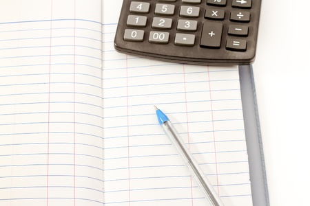 Papers on financial figures with calculator and pen の写真素材