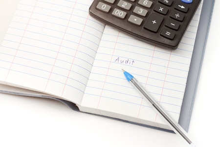 Papers on financial figures with calculator and pen の写真素材
