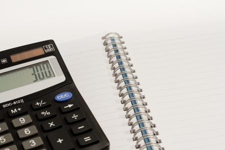 Calculator, press the number to 300 and blank book の写真素材