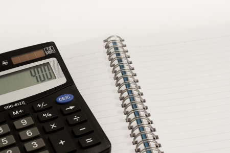 Calculator, press the number to 400 and blank book の写真素材