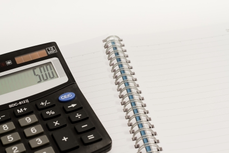 Calculator, press the number to 500 and blank book の写真素材