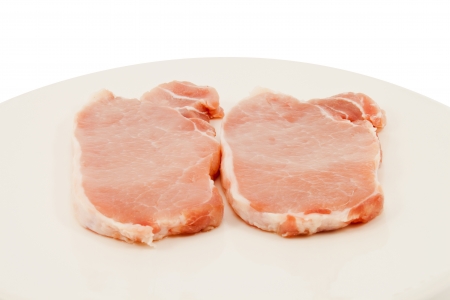 Two slices of raw pork  Raw pork preparing to cook の写真素材