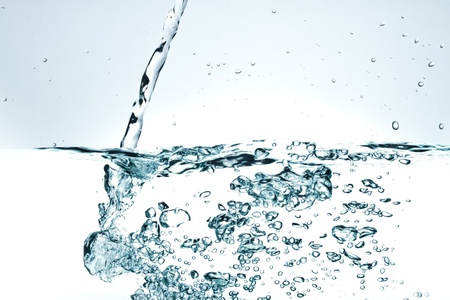 Flowing water with air bubbles. Abstract water splash.の写真素材