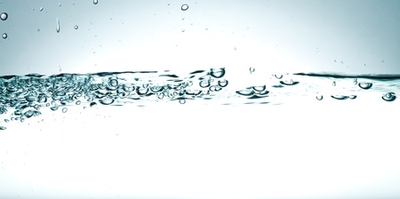 Flowing water with air bubbles. Abstract water splash.の写真素材