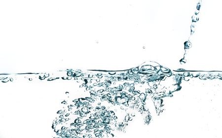 Flowing water with air bubbles. Abstract water splash.の写真素材