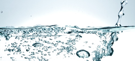 Flowing water with air bubbles. Abstract water splash.の写真素材