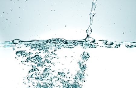 Flowing water with air bubbles. Abstract water splash.の写真素材
