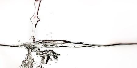 Flowing water with air bubbles. Abstract water splash.の写真素材