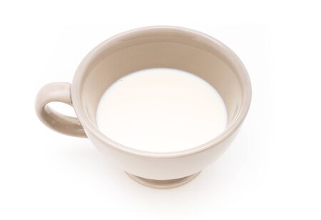 Ceramic cup of milk on white background の写真素材