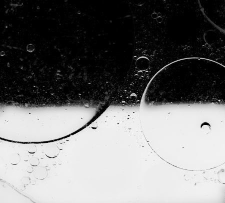 Oil drops on a water surface  Abstract background 