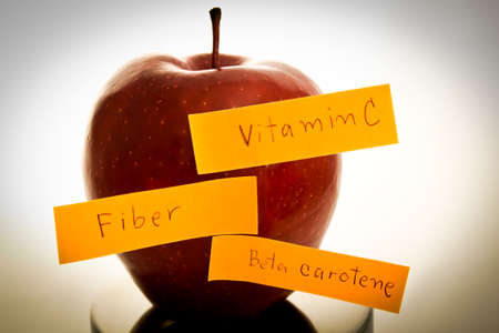Closeup dark red apple fruit  Apple wrote a fiber, vitamins, beta-carotene の写真素材