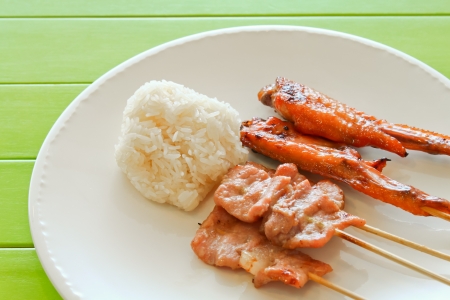 Roast Pork with sticky rice on the plate の写真素材