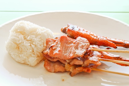 Roast Pork with sticky rice on the plate の写真素材
