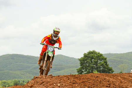 Motocross bike in a race. 
FMSCT Thailand Supercross 2013, Round 7 - Saraburi Race 
Nawaphop MX Muaklek Saraburi Thailand on August 4, 2013.のeditorial素材
