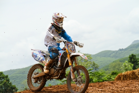 Motocross bike in a race. 
FMSCT Thailand Supercross 2013, Round 7 - Saraburi Race 
Nawaphop MX Muaklek Saraburi Thailand on August 4, 2013.のeditorial素材