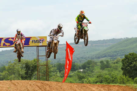 Motocross bike in a race. 
FMSCT Thailand Supercross 2013, Round 7 - Saraburi Race 
Nawaphop MX Muaklek Saraburi Thailand on August 4, 2013.のeditorial素材