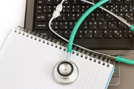 Medical stethoscope and a portable laptop. Medical Information and technology concept.の写真素材