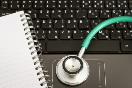 Medical stethoscope and a portable laptop. Medical Information and technology concept.の写真素材