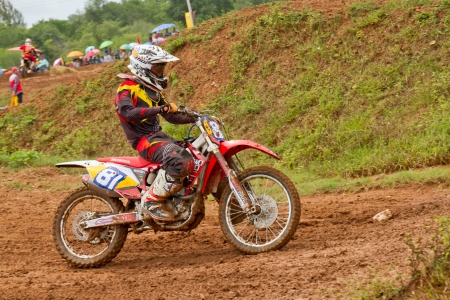 Motocross bike in a race. 
FMSCT Thailand Supercross 2013, Round 7 - Saraburi Race 
Nawaphop MX Muaklek Saraburi Thailand on August 4, 2013.のeditorial素材