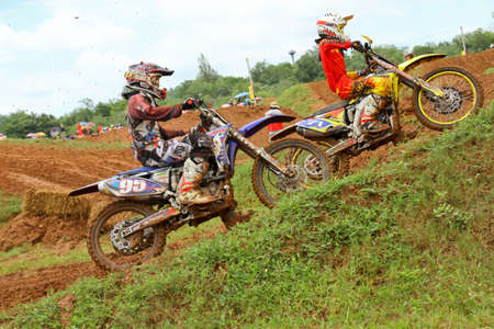 Motocross bike in a race. 
FMSCT Thailand Supercross 2013, Round 7 - Saraburi Race 
Nawaphop MX Muaklek Saraburi Thailand on August 4, 2013.のeditorial素材