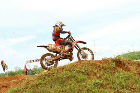 Motocross bike in a race. 
FMSCT Thailand Supercross 2013, Round 7 - Saraburi Race 
Nawaphop MX Muaklek Saraburi Thailand on August 4, 2013.のeditorial素材