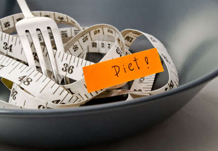 Diet messages  Plate fork and measure tape の写真素材