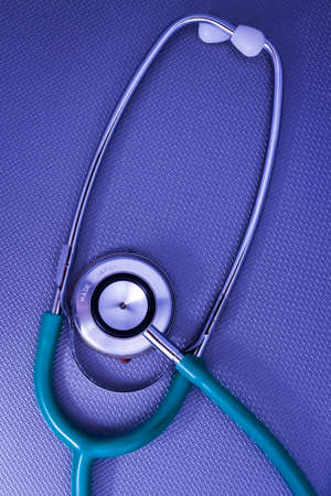 Stethoscope on the metal blue surface の写真素材
