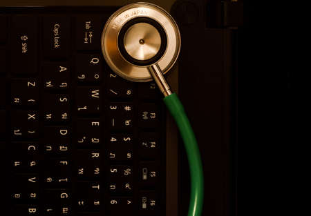 Medical stethoscope and a portable laptop  Medical Information and technology concept の写真素材