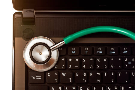 Medical stethoscope and a portable laptop  Medical Information and technology concept の写真素材