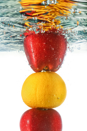 Fresh fruit submerged under water.の写真素材
