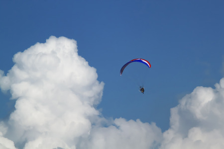 Paraglider flying in the sky.の写真素材