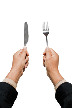 Knife and fork holding by businessman hands.の写真素材