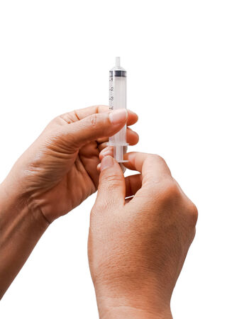 Hand holding syringe.の写真素材