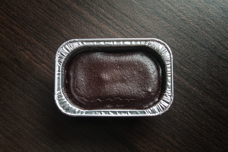 Foil box of chocolate cake.の写真素材