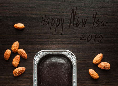Foil box of chocolate cake. Happy new year 2015.の写真素材