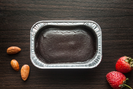 Foil box of chocolate cake.の写真素材
