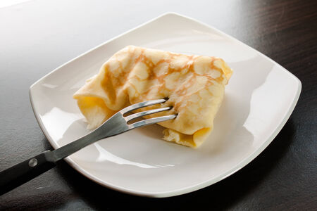 Dessert crepes on a white plate.の写真素材